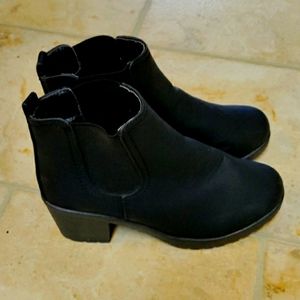 Black Ankle Boots with three inch heels.